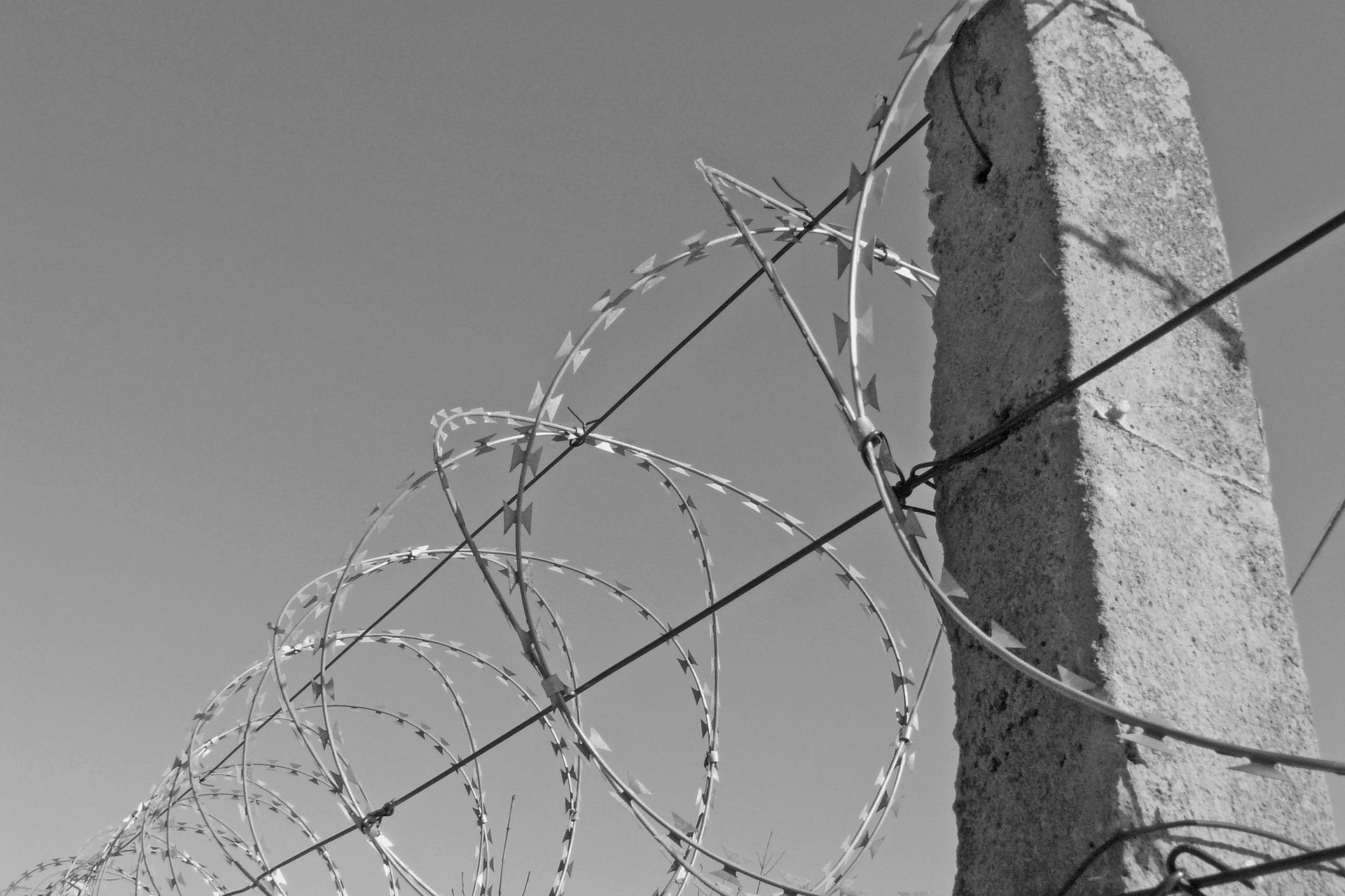 photo of barbed wire outside a prison